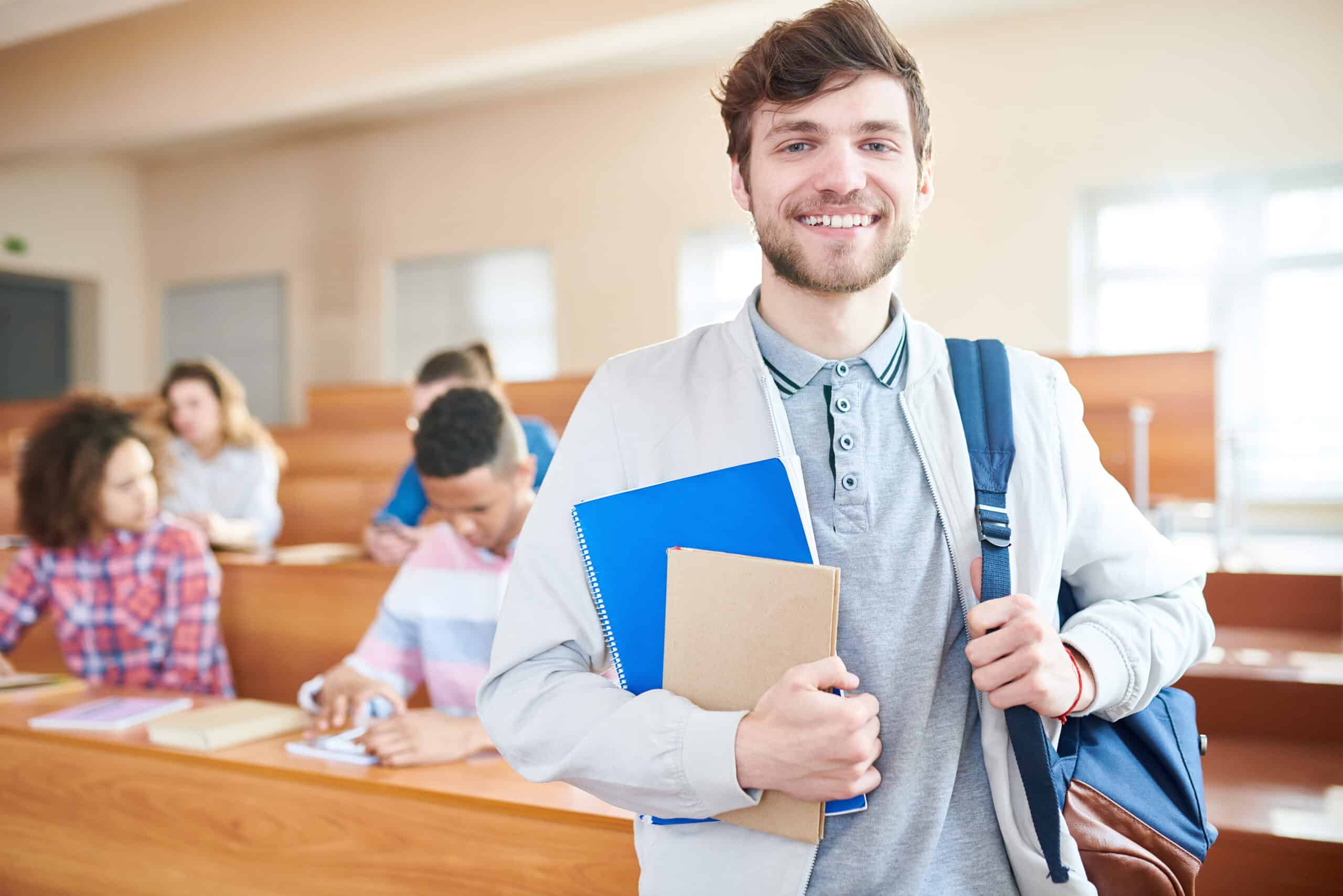 Academic Approach Tutoring and Test Prep | A man in a classroom holding a backpack.